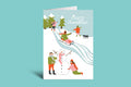 Christmas card with people building a snowman on a green background