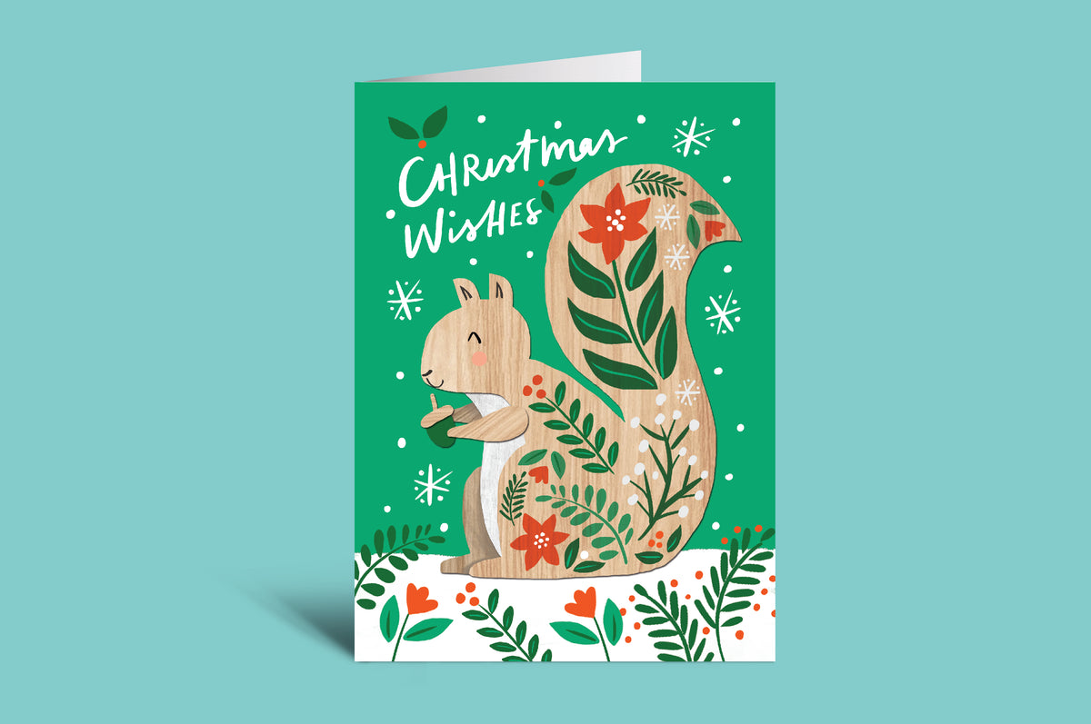 Christmas card with a squirrel design on a green background