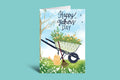 Father's Day card with a wheelbarrow, garden tools, and 'Happy Father's Day' text on a green background.