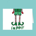 Cartoon elf legs with 'I'm Back!' text on a white card against a teal background