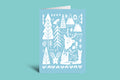 Greeting card with white forest design on a light blue background