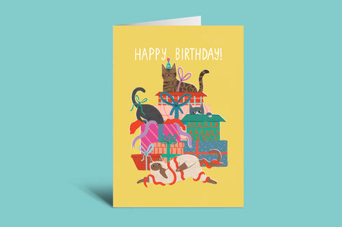 Birthday card with cats and presents on a yellow background