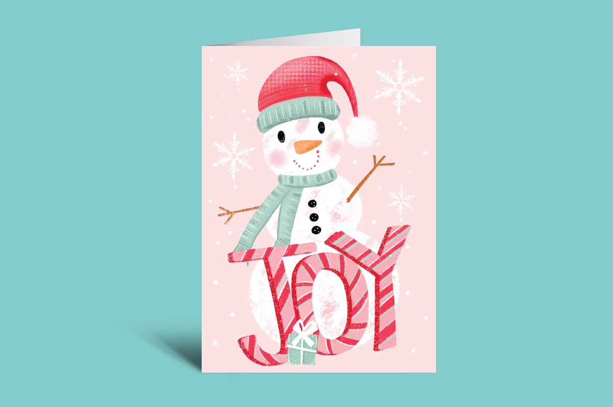 Christmas card with a snowman design on a pink background