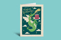 Birthday card with a dragon holding a cake on a green background