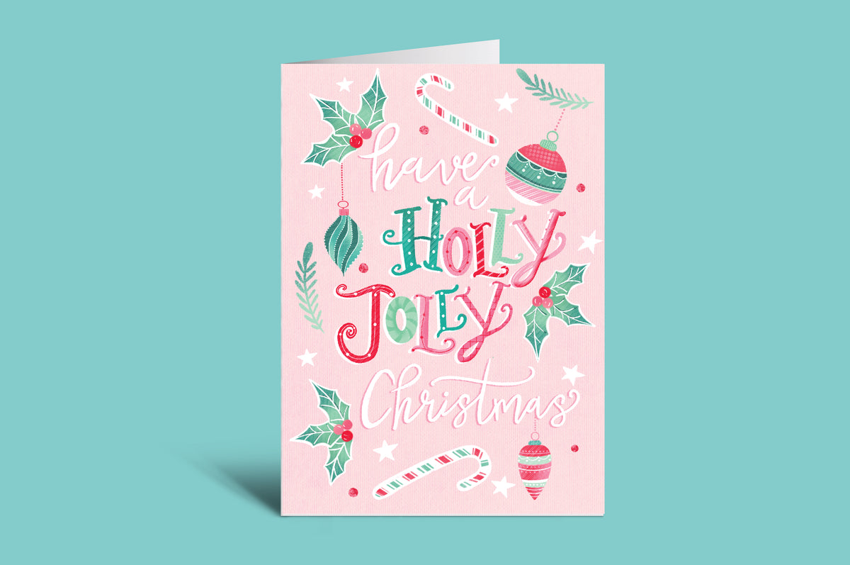Pink Christmas card with 'Holly Jolly Christmas' text on a green background