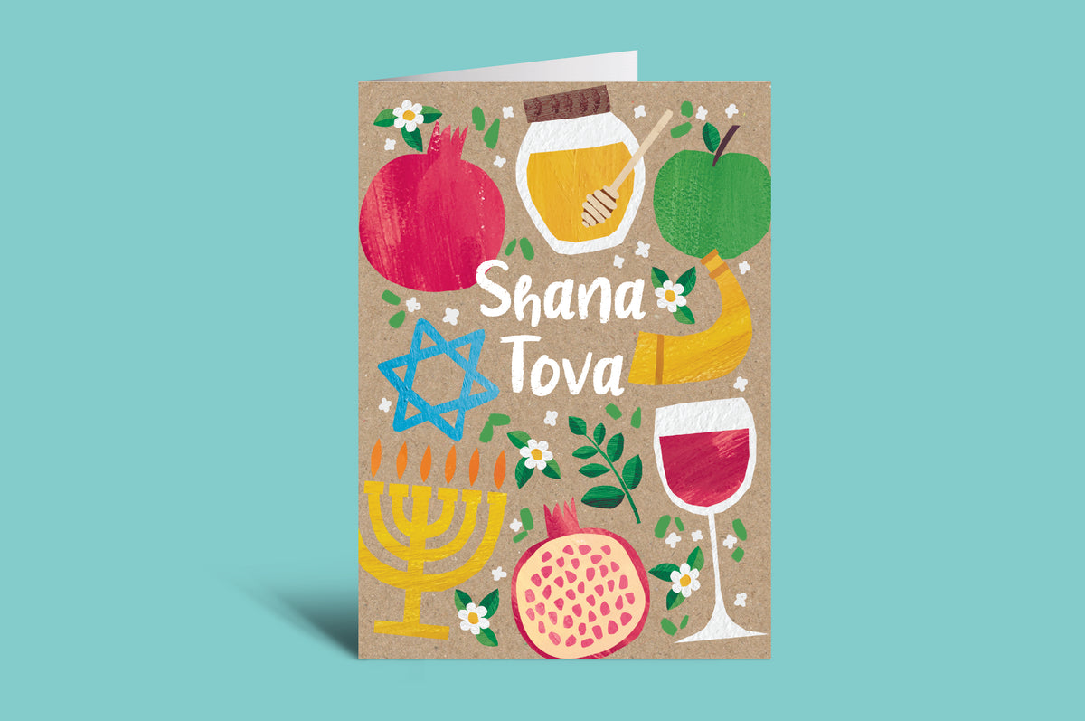 Card with colorful illustrations of pomegranates, apples, wine glasses, and a menorah on a green background.