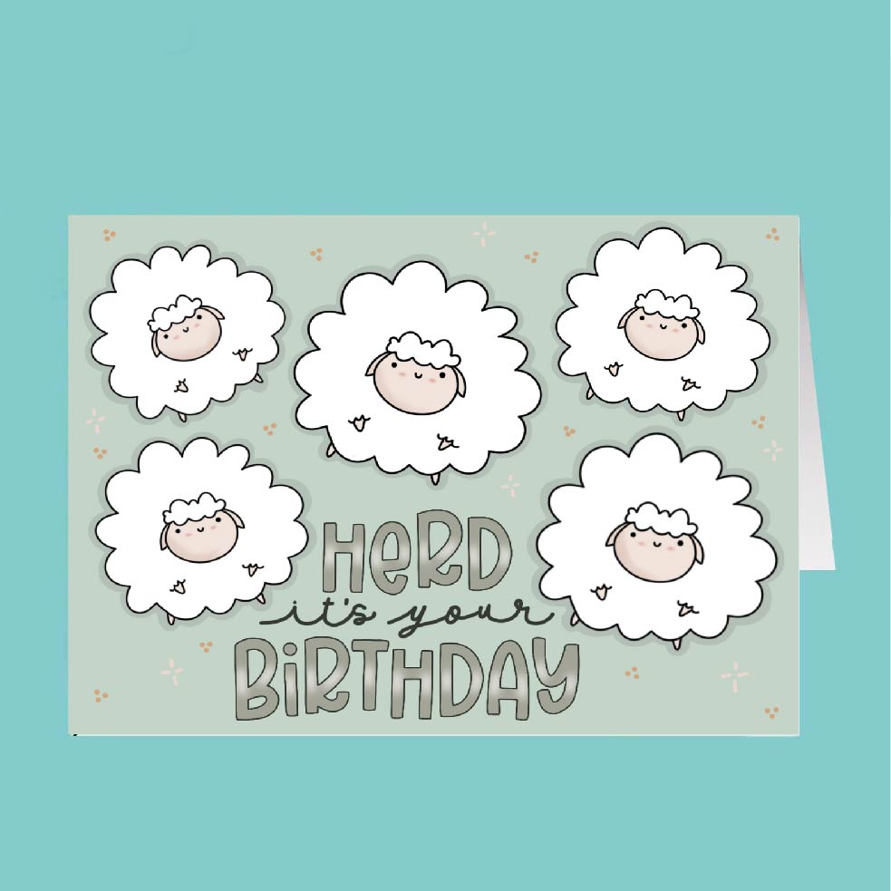 Card with cartoon sheep and 'Herd it's your Birthday' text on a light blue background