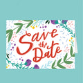 Save the Date card with red text and floral decorations on a white background