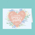 Card with a heart-shaped design and 'sending heartfelt sympathy' text on a teal background