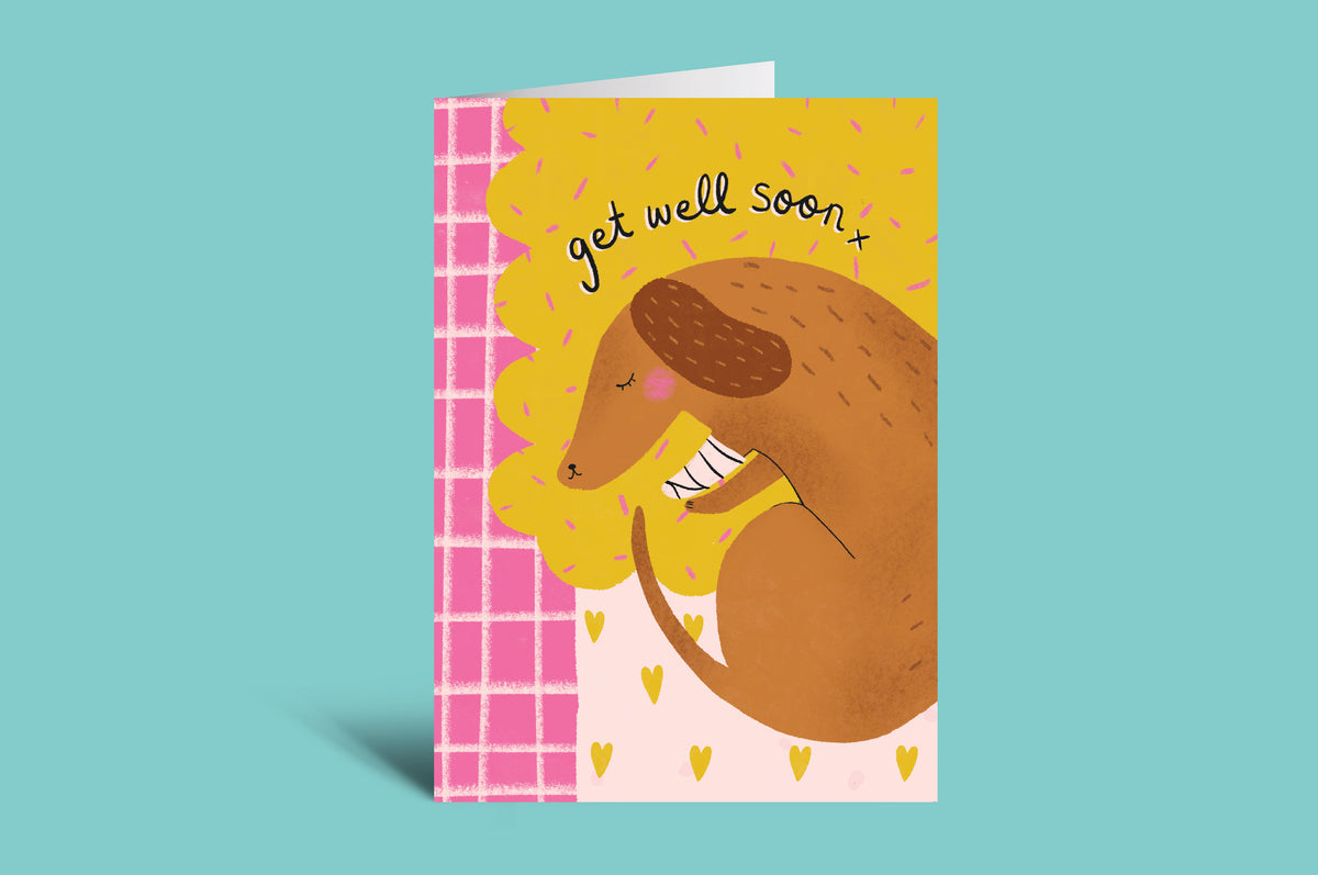 Greeting card with a kangaroo illustration and 'get well soon' text on a colorful background