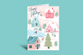 Holiday card with festive village design on a teal background