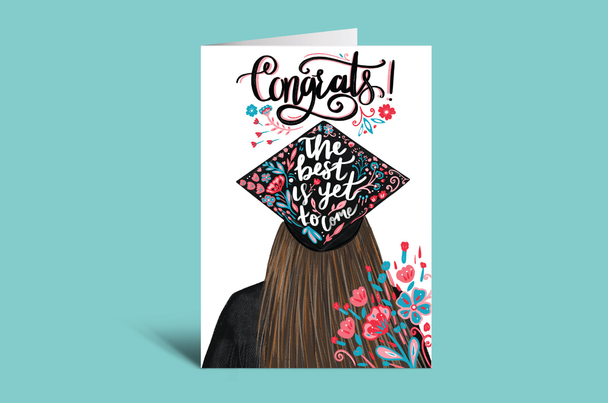 Graduation-themed card with colorful cap and text on a teal background