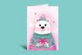 Greeting card with a polar bear illustration wearing a green sweater on a light green background