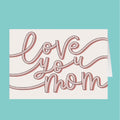 Card with 'love you mom' text on a teal background