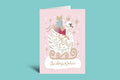 Christmas card with a swan holding a gift on a pink background