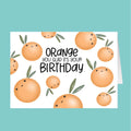 Birthday card with cartoon oranges and text 'Orange you glad it's your birthday' on a teal background