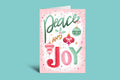 Greeting card with 'Peace and Joy' text and Christmas ornaments on a pink background