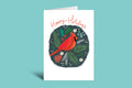 Holiday card with a red cardinal and festive elements on a green background