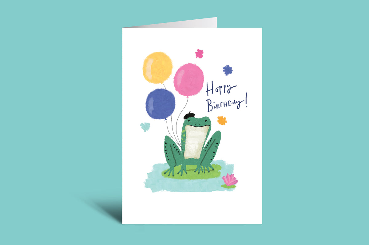 Birthday card with a frog and balloons on a green background