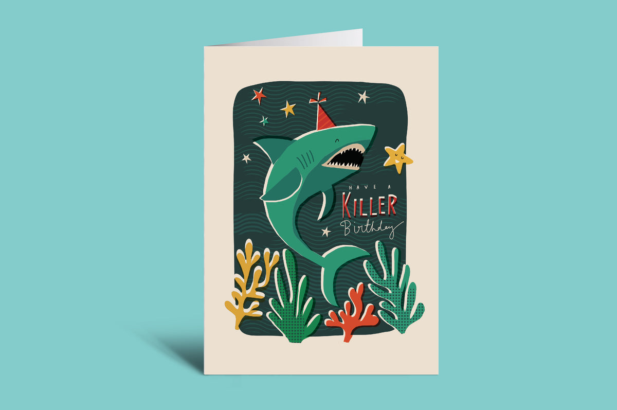 Greeting card with a shark design on a green background