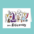 Greeting card with witch-themed illustrations and 'have a Wicked Birthday' text on a teal background