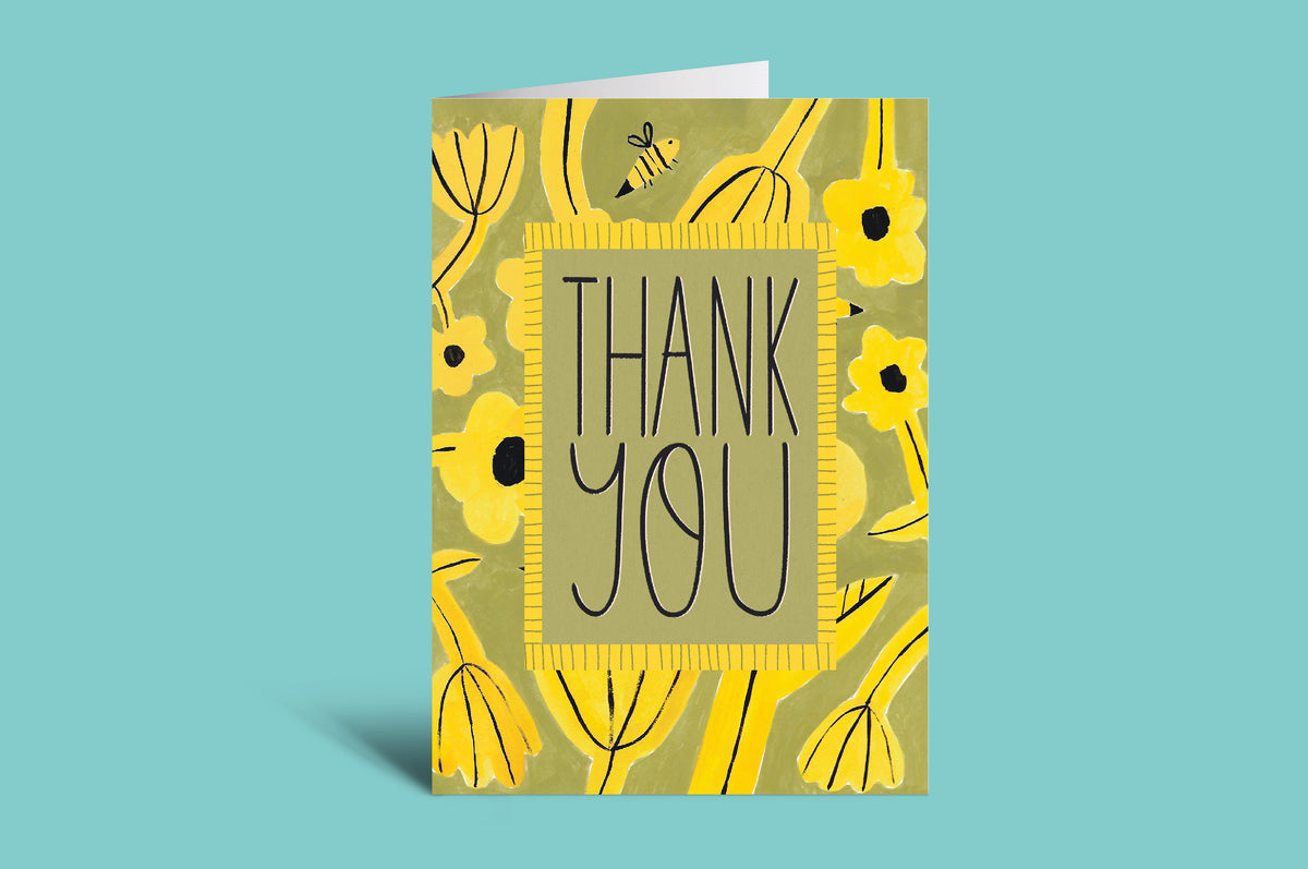 Greeting card with 'Thank You' text and floral design on a green background