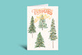 Greeting card with Christmas tree illustrations and 'Treetops Salutation' text on a teal background