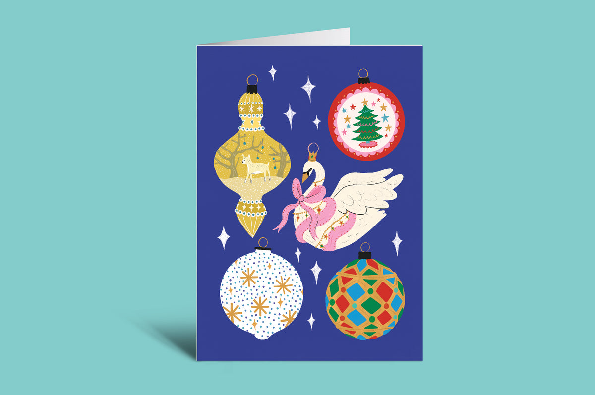 Decorative card with Christmas ornaments on a blue background