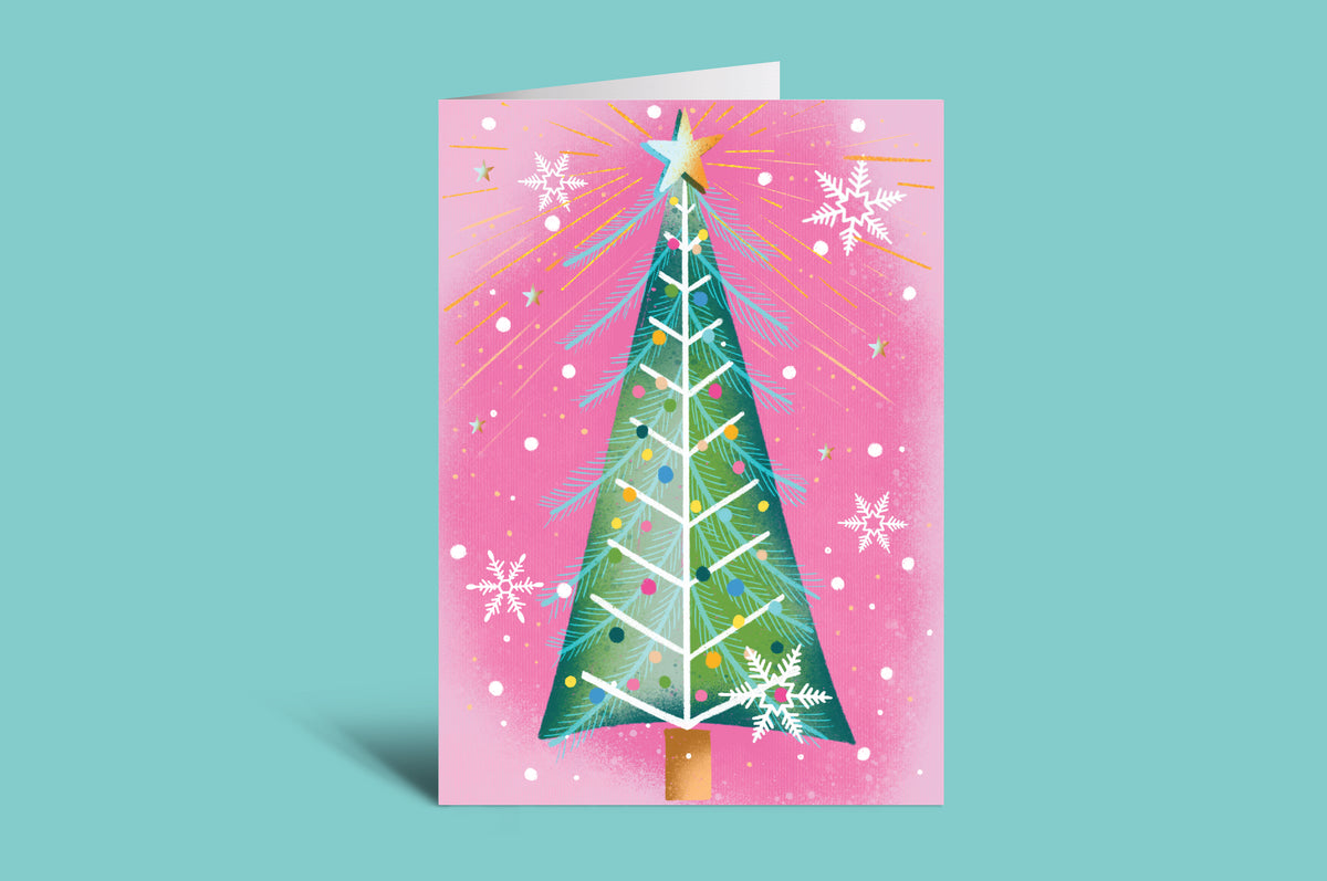 Christmas card with a green tree and star on a pink background