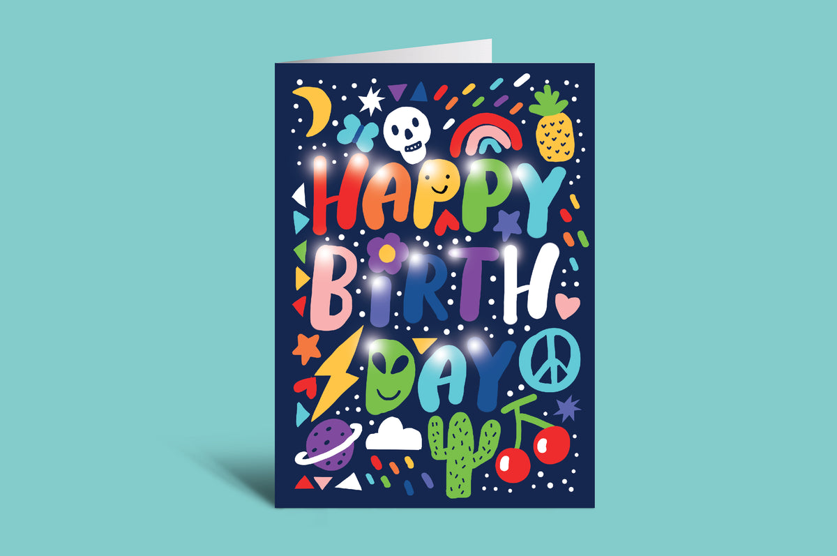 Colorful birthday card with various symbols on a teal background