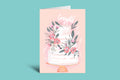 Greeting card with floral design and 'Congrats' text on a pink background