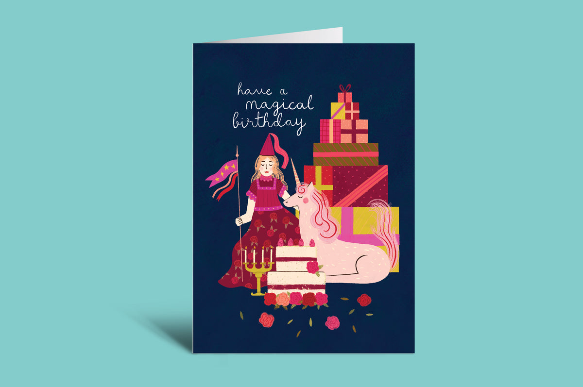 Birthday card with a wizard, unicorn, and presents on a teal background