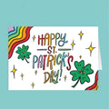 St. Patrick's Day card with colorful text and shamrocks on a teal background