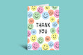 Greeting card with colorful smiley face pattern and 'Thank You' text on a green background