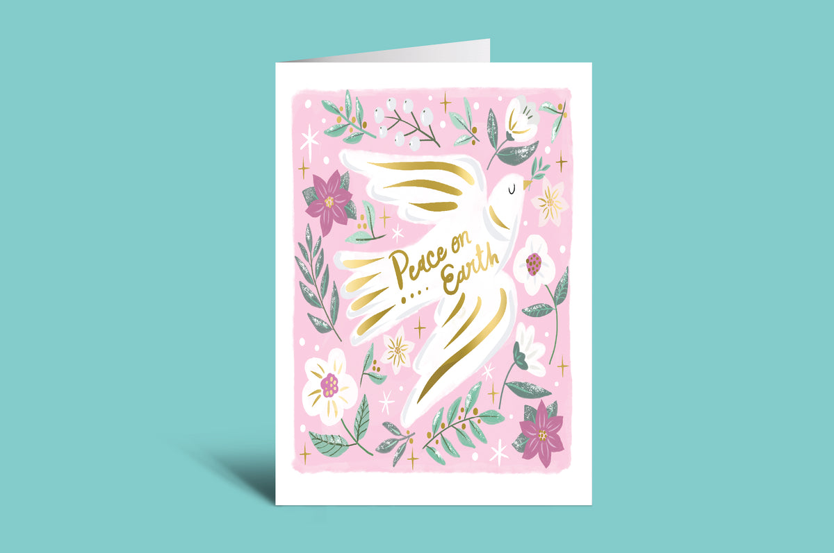 Greeting card with floral design and 'Peace on Earth' text on a pink background