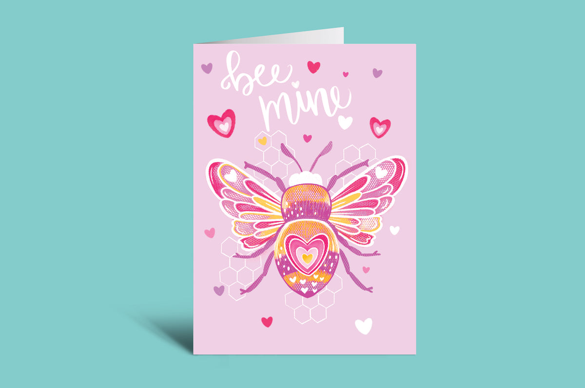 Greeting card with a bee design and 'bee mine' text on a pink background