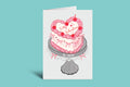 Valentine's Day card with a heart-shaped cake on a green background