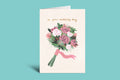 Wedding card with floral design and 'on your wedding day' text on a green background