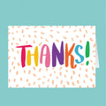 Colorful 'THANKS!' card with a white background and orange dots on a teal background