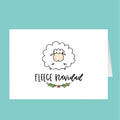 Card with a sheep illustration and 'Fleece Navidad' text on a teal background