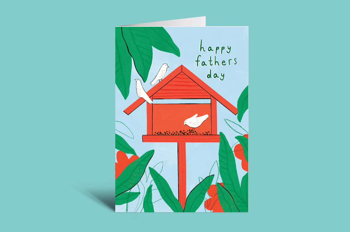 Father's Day card with a red birdhouse and birds on a green background