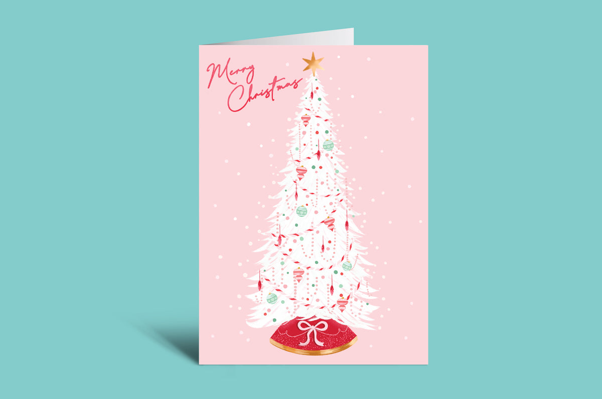 Christmas card with a white Christmas tree on a pink background