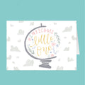 Greeting card with 'Welcome little one' text on a decorative globe design, on a teal background.