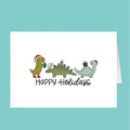 Card with cartoon dinosaurs wearing Christmas hats and holding presents, text 'Happy Holidays' on a teal background.