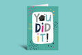 Graduation-themed card with 'You Did It!' text on a green background