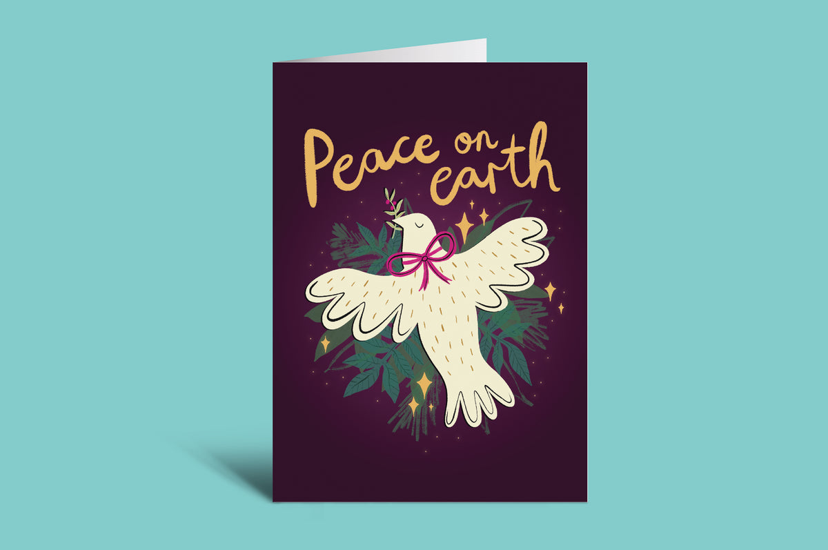 Greeting card with a dove and 'Peace on Earth' text on a teal background