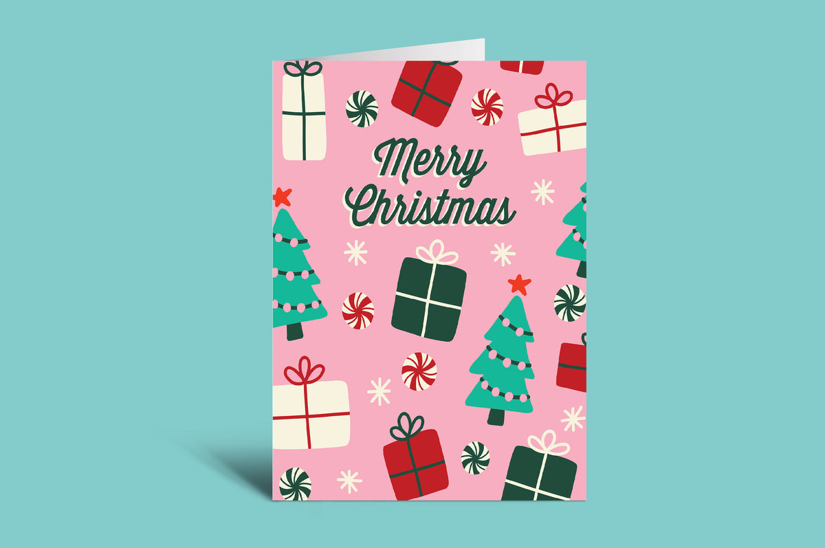 Christmas-themed card with presents and trees on a pink background