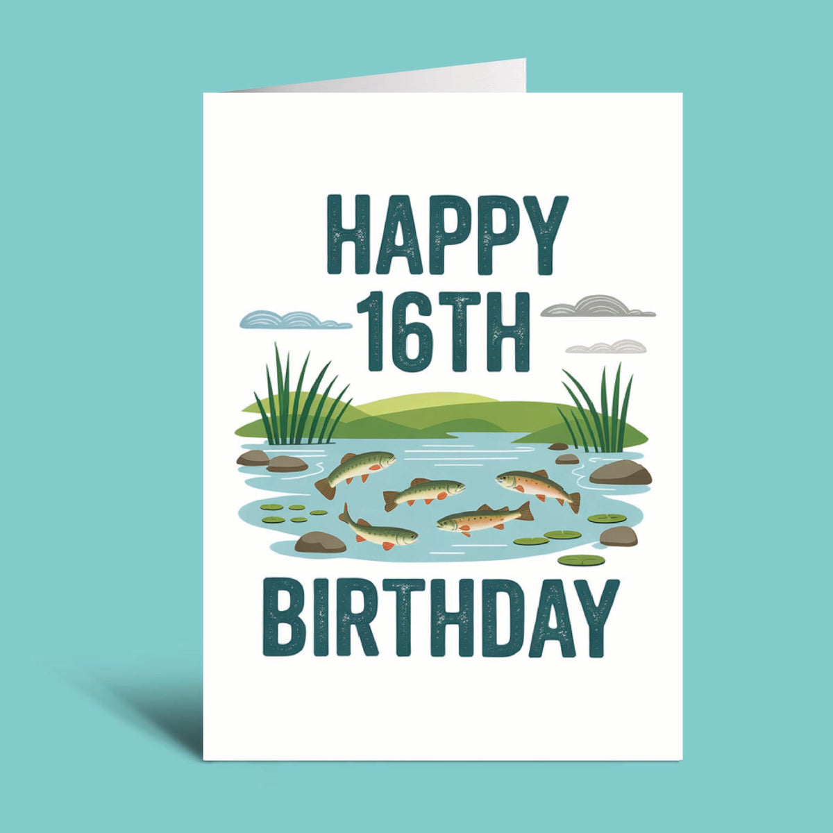 A folded white birthday card standing upright on a light aqua background. The card reads “HAPPY 16TH BIRTHDAY” in large dark teal letters and features a small illustrated scene of fish in a pond with reeds and clouds.