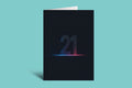 A black greeting card standing upright on a light aqua background, featuring the number 21 in a glowing neon-style outline with a blue-to-pink gradient and a horizontal light effect.