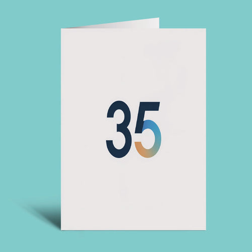 A white greeting card standing upright on a light aqua background, featuring the number 35 in dark navy with a blue-to-gold gradient on the 5.